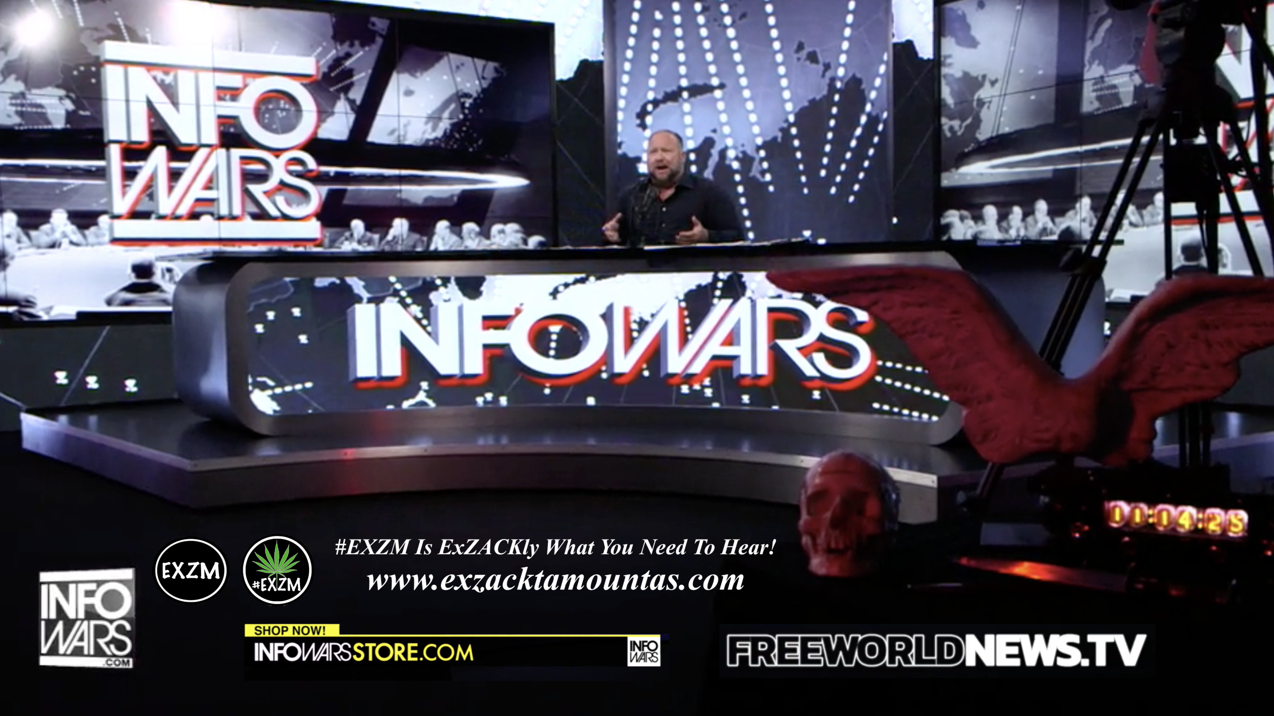 Alex Jones Live In Infowars Studio Free World News TV Human Skull Angel Wings Dagger EXZM Zack Mount July 15th 2021 copy